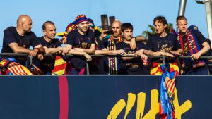 Barcelona, Spain - May 15, 2016: Players and coaches of FC Barcelona celebrate the Spanish League trophy with a parade on the streets of Barcelona, Spain.